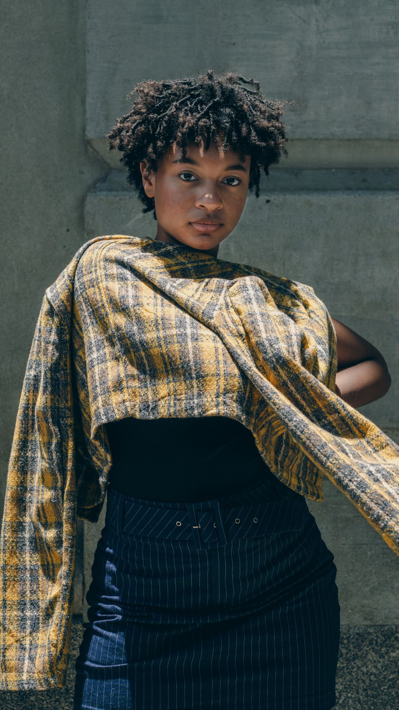Model in a gold and black tailored look